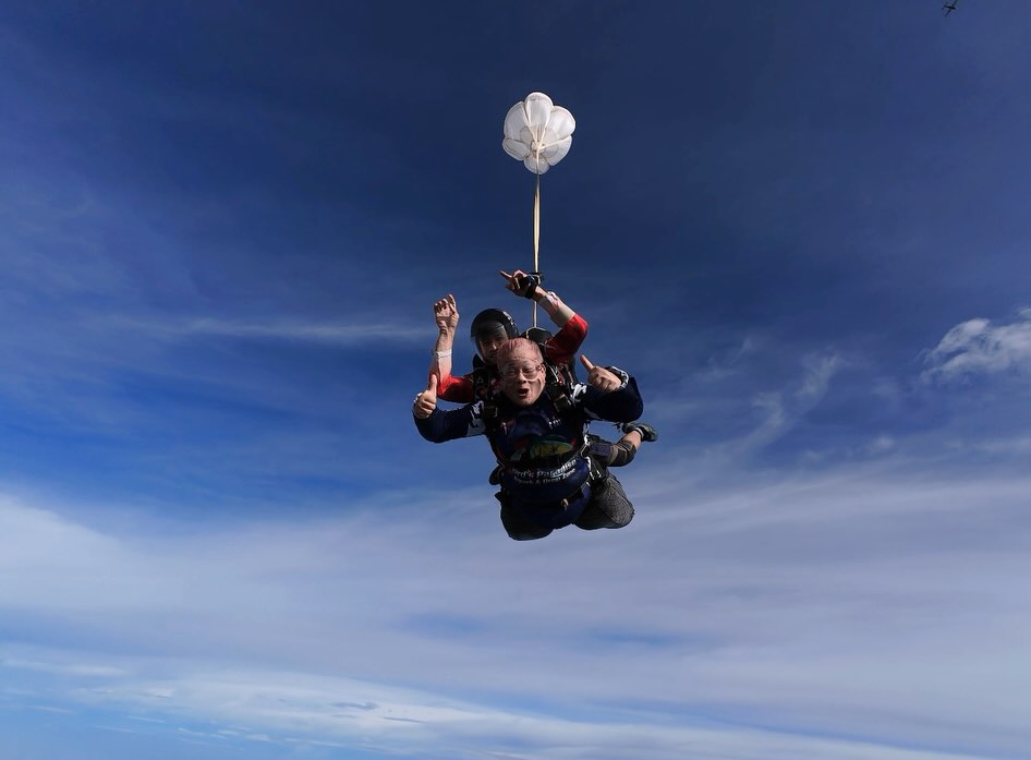 Tandem pair in freefall over the rice fields